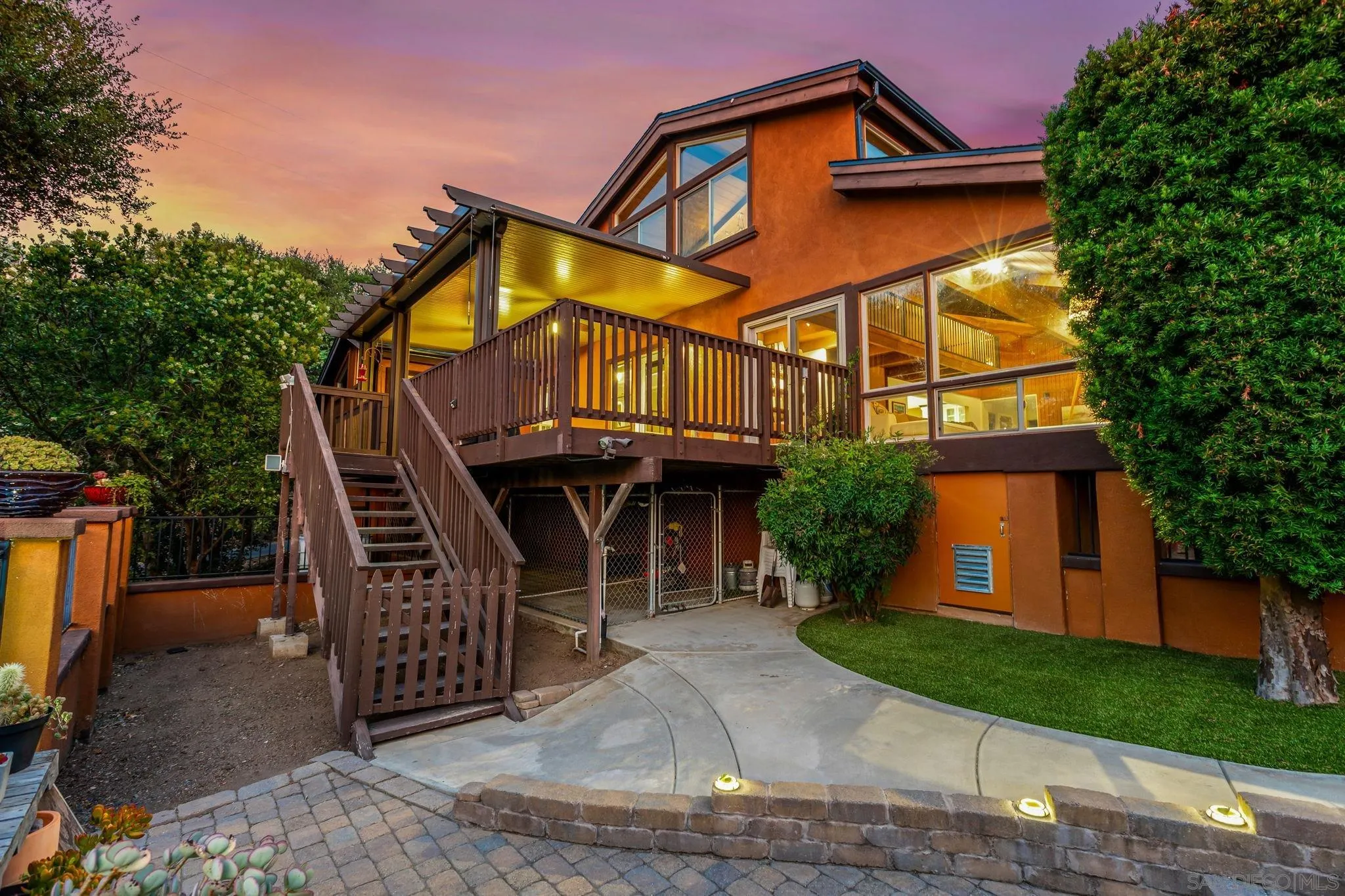 a view of a house with a yard and plants