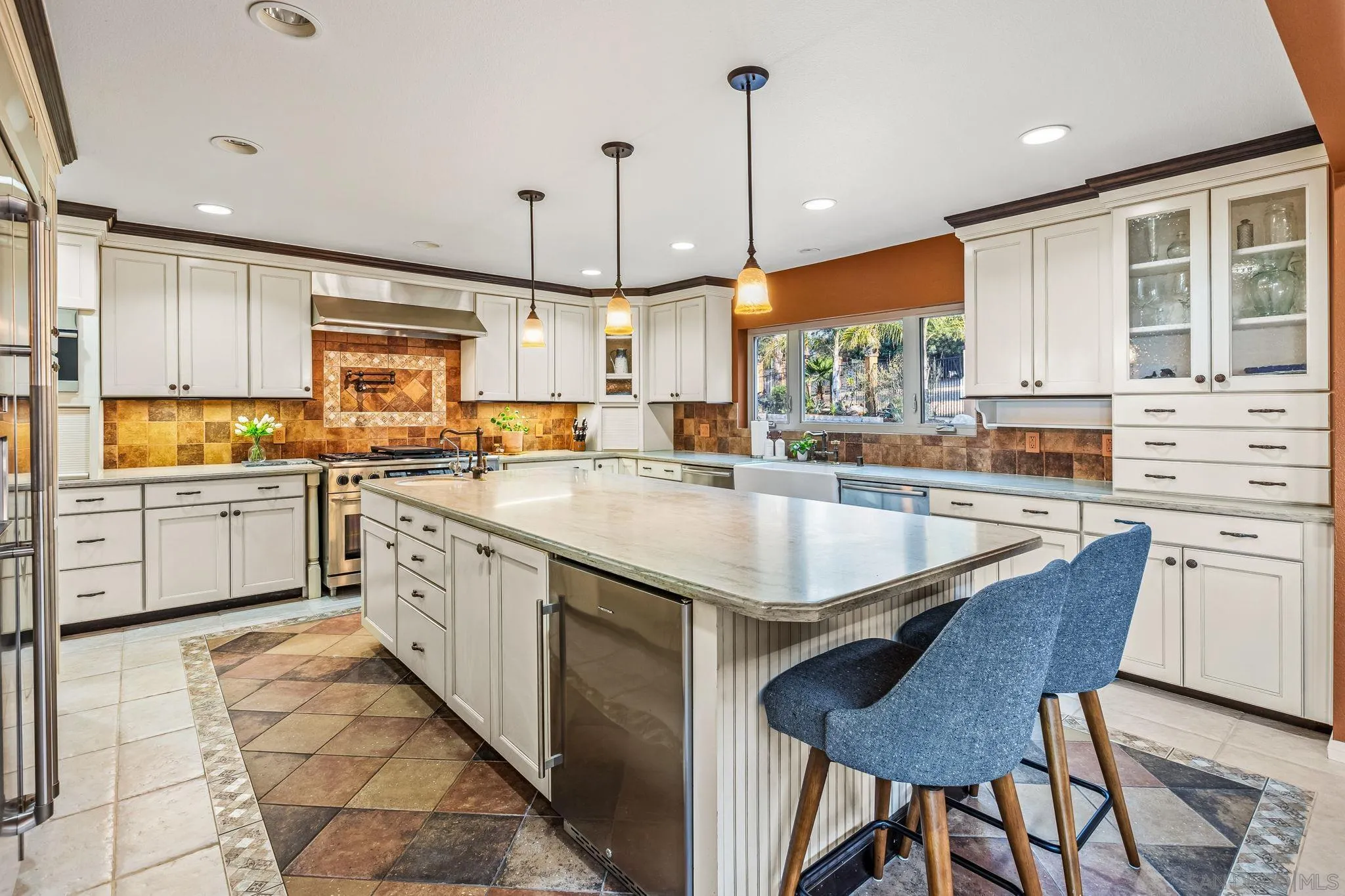 2260 East Mission Road Fallbrook, CA 92028 - Photo 14 of 38 a kitchen with stainless steel appliances granite countertop a sink a stove a refrigerator and island with wooden floor