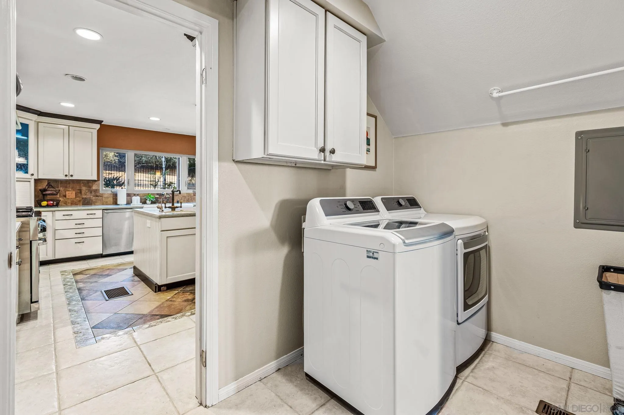 2260 East Mission Road Fallbrook, CA 92028 - Photo 17 of 38 a utility room with dryer washer and storage