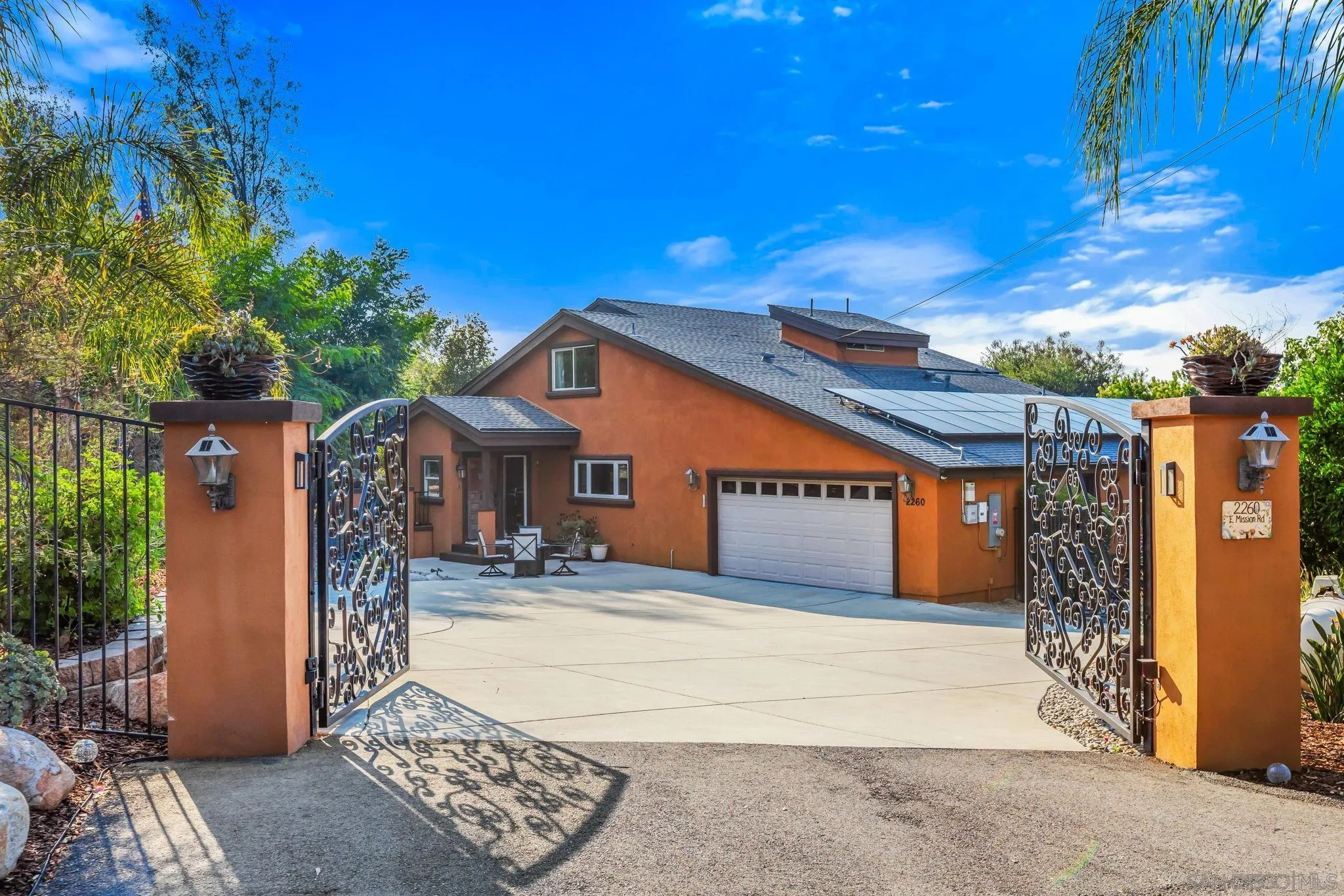 2260 East Mission Road Fallbrook, CA 92028 - Photo 2 of 38 a front view of a house with trees