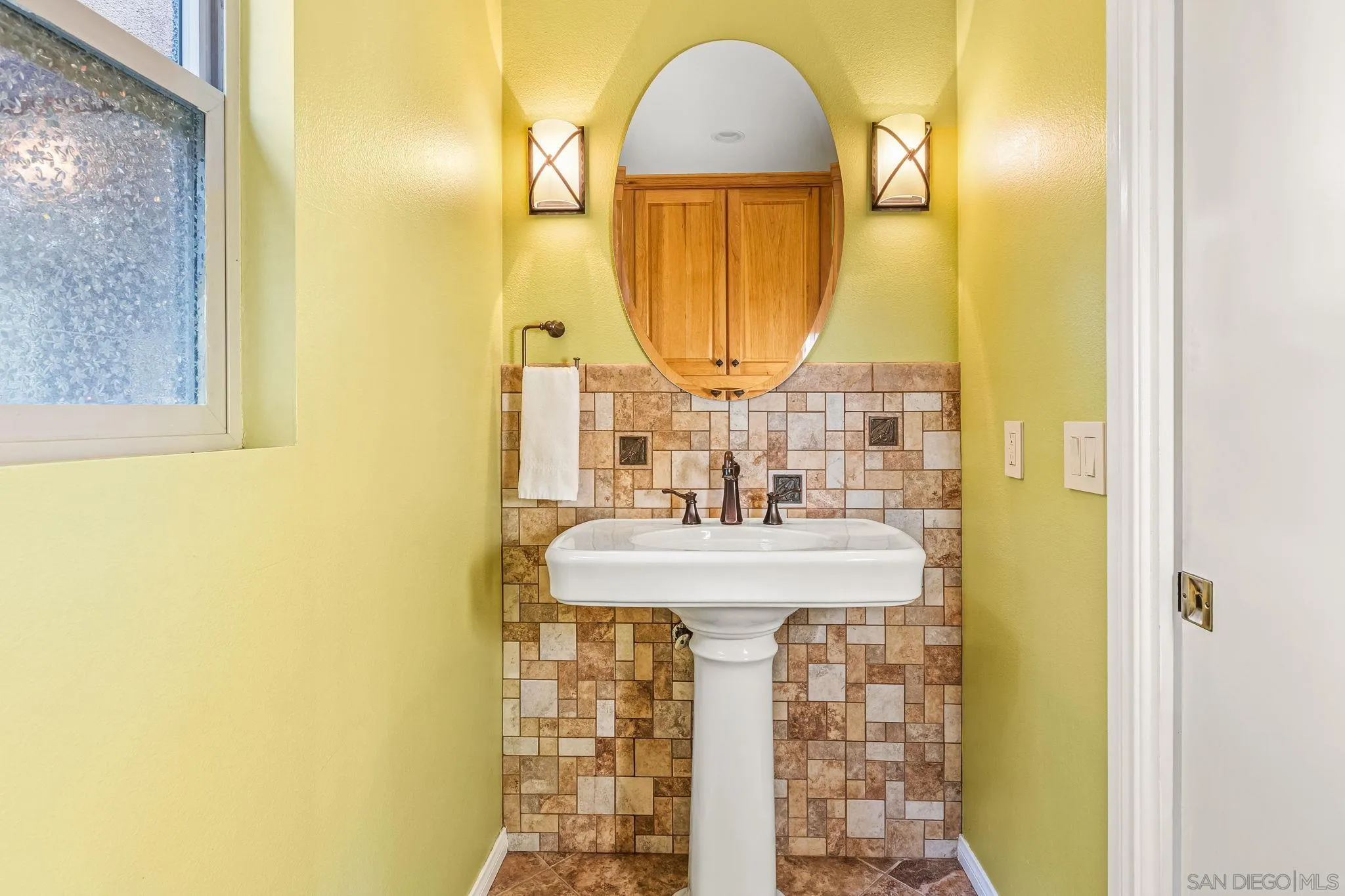 2260 East Mission Road Fallbrook, CA 92028 - Photo 22 of 38 a bathroom with a sink and a mirror