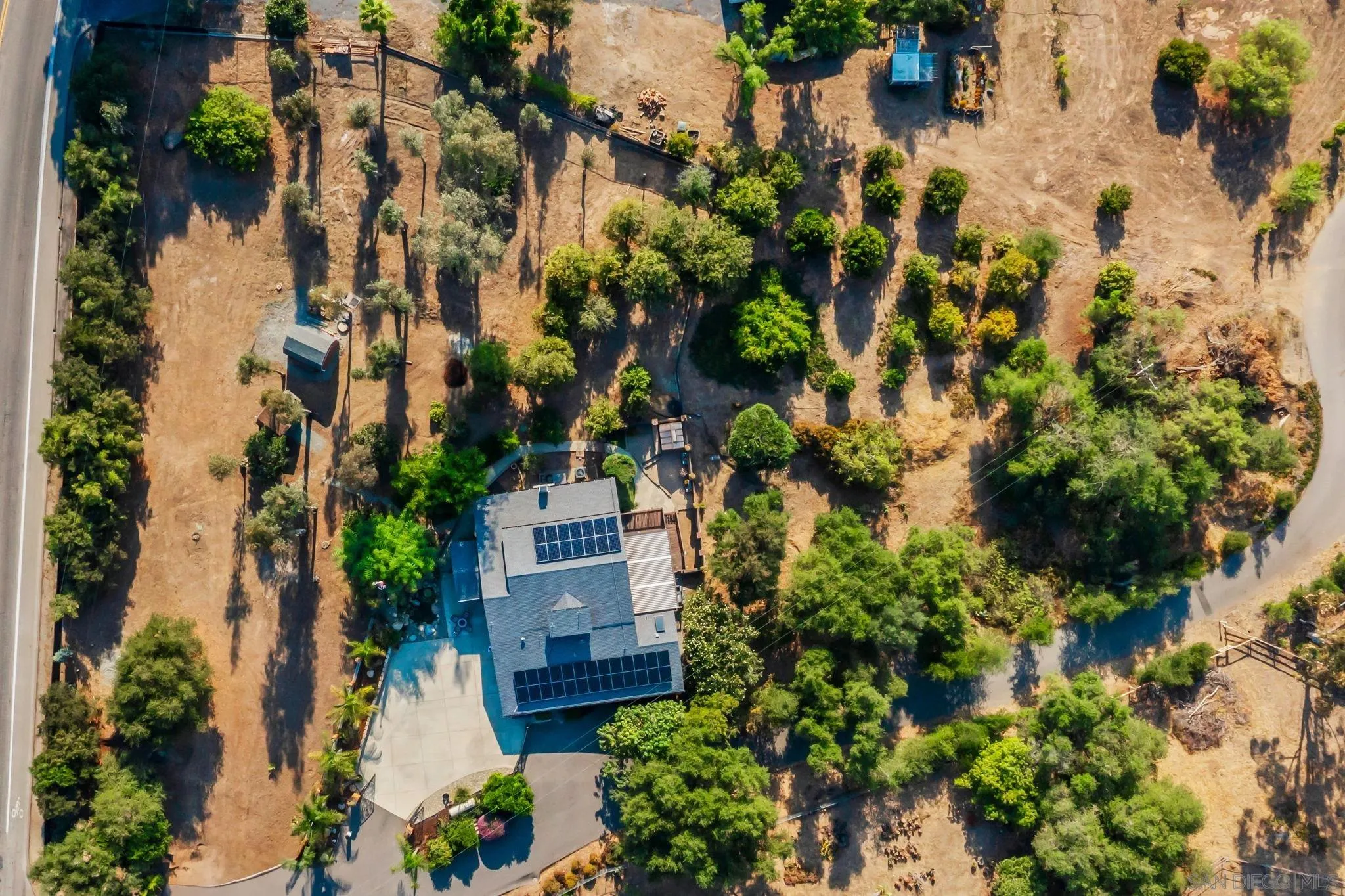 2260 East Mission Road Fallbrook, CA 92028 - Photo 27 of 38 an aerial view of a house with a yard and garden