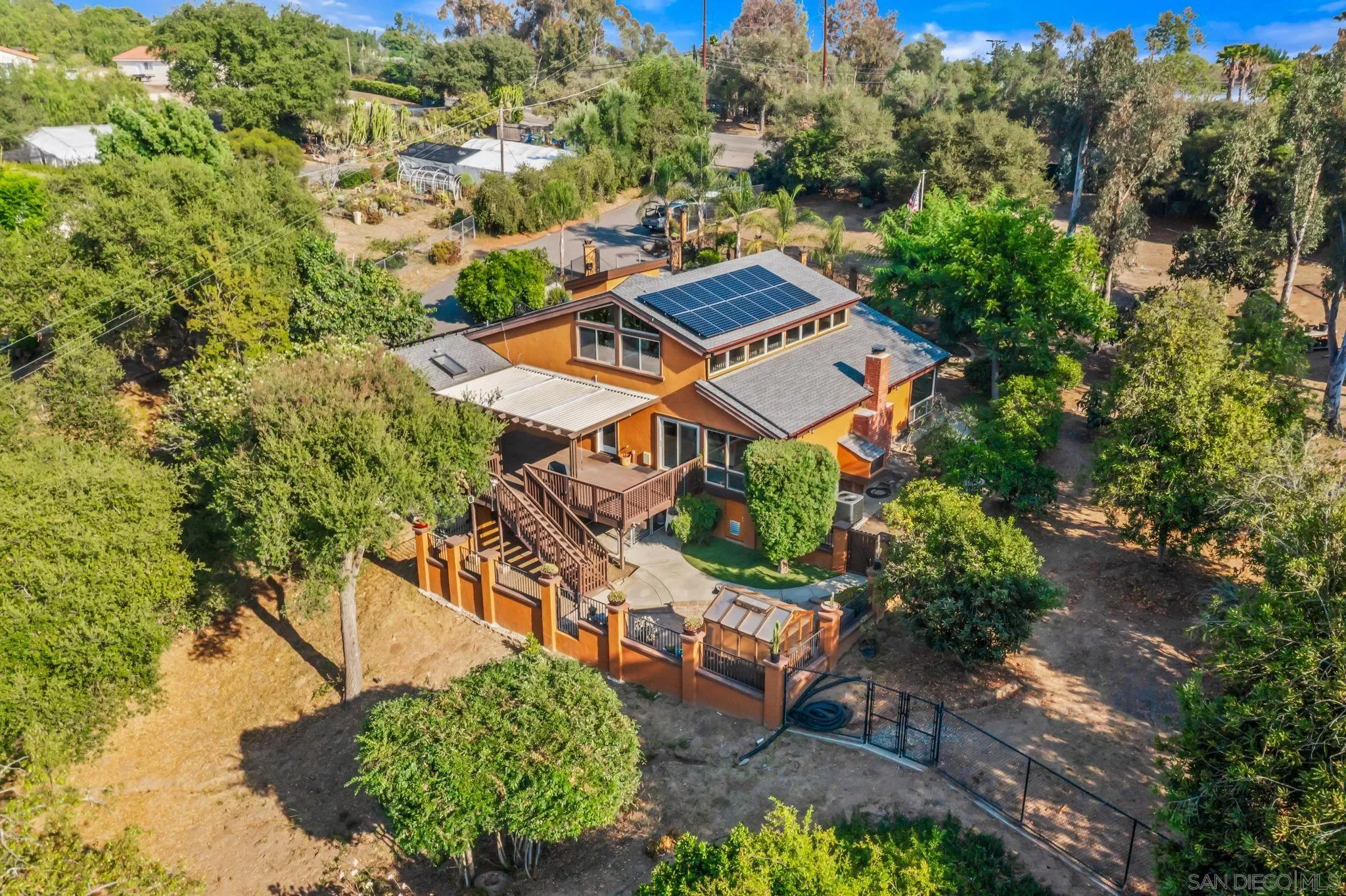 2260 East Mission Road Fallbrook, CA 92028 - Photo 29 of 38 an aerial view of a house with a yard and trees