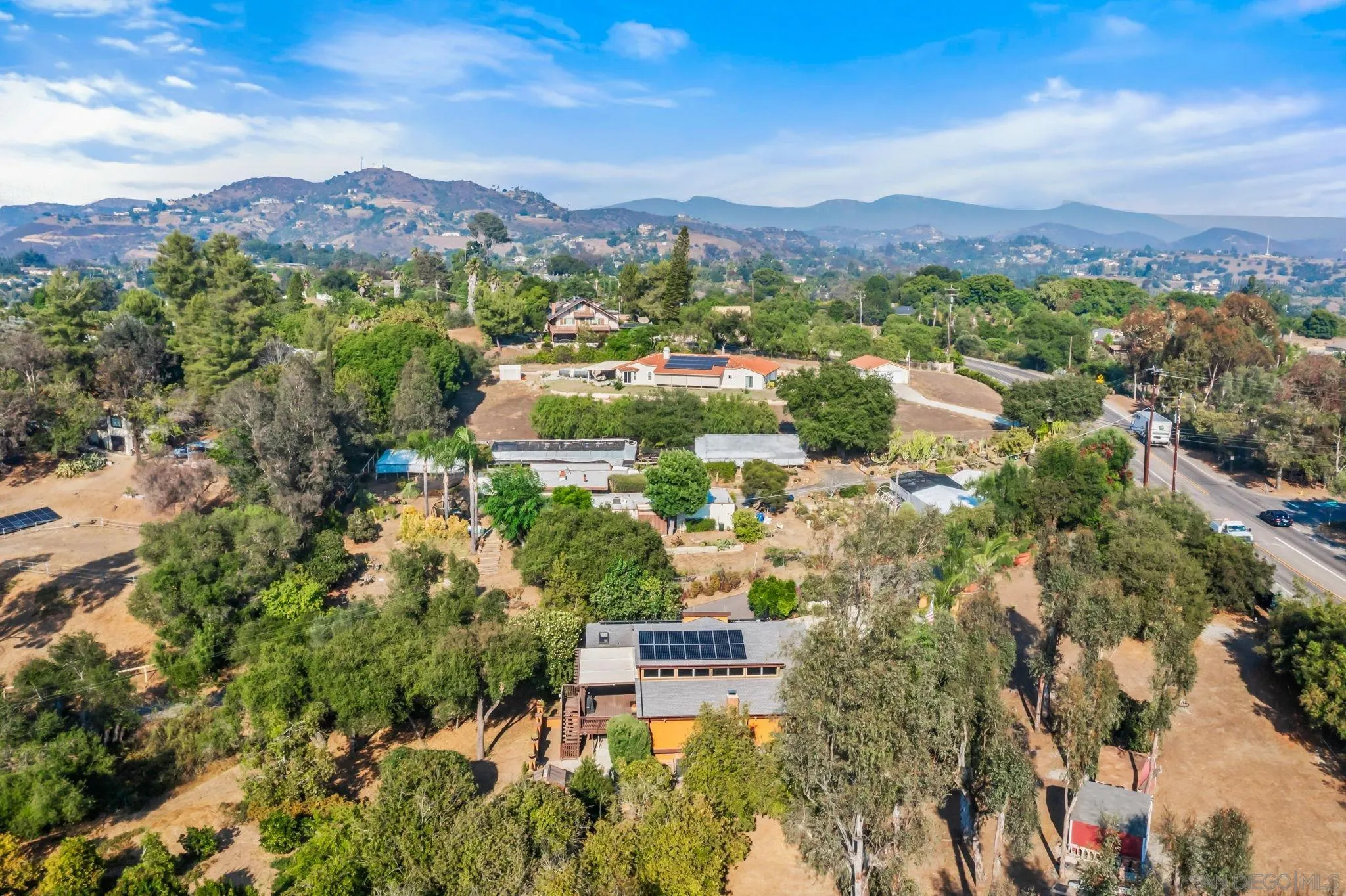 2260 East Mission Road Fallbrook, CA 92028 - Photo 30 of 38 a view of a city with mountains in the background