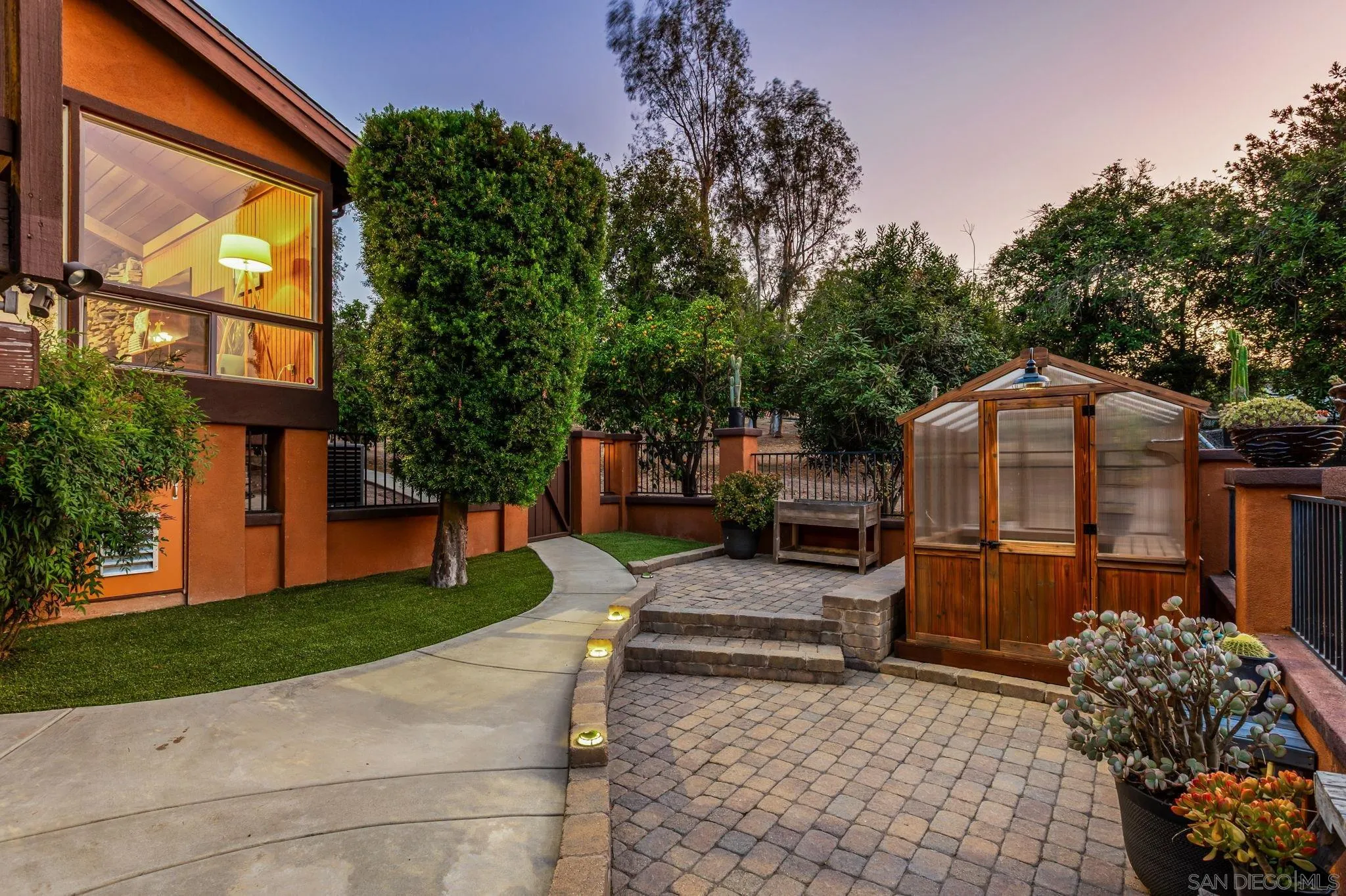 2260 East Mission Road Fallbrook, CA 92028 - Photo 34 of 38 a backyard of a house with barbeque oven and outdoor seating