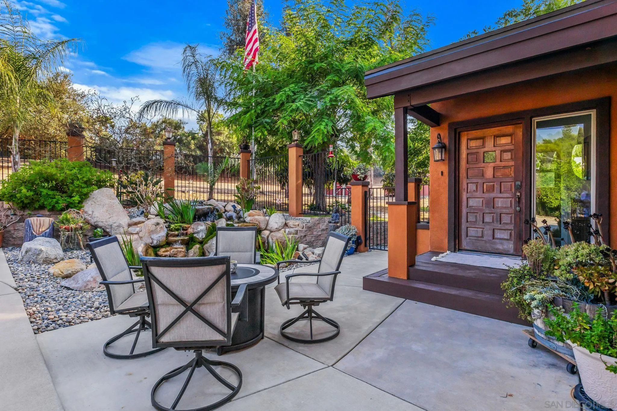 2260 East Mission Road Fallbrook, CA 92028 - Photo 5 of 38 a view of patio with chairs and potted plants