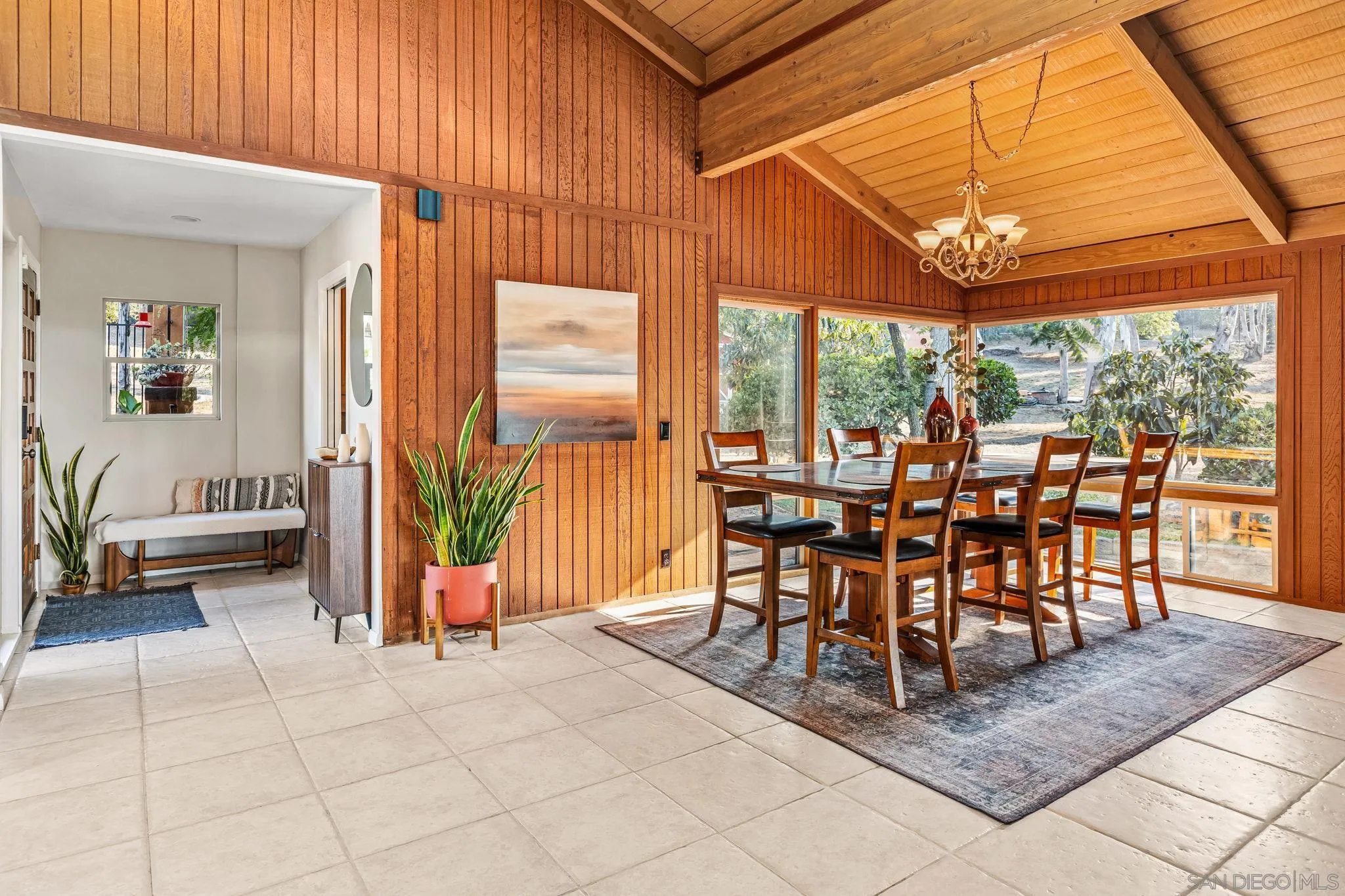 2260 East Mission Road Fallbrook, CA 92028 - Photo 6 of 38 a view of a patio with table and chairs and floor to ceiling window