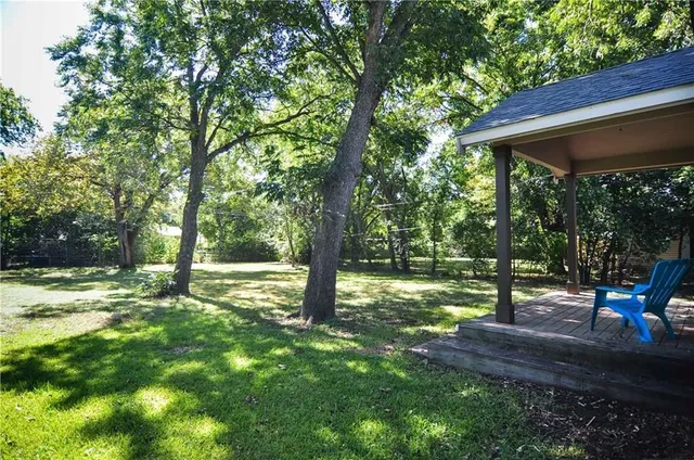 a view of outdoor space with deck and yard