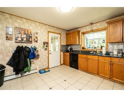 17 Babb Road Southwick, MA 01077 - Photo 5 of 20 a kitchen with stainless steel appliances kitchen island granite countertop a refrigerator and a sink