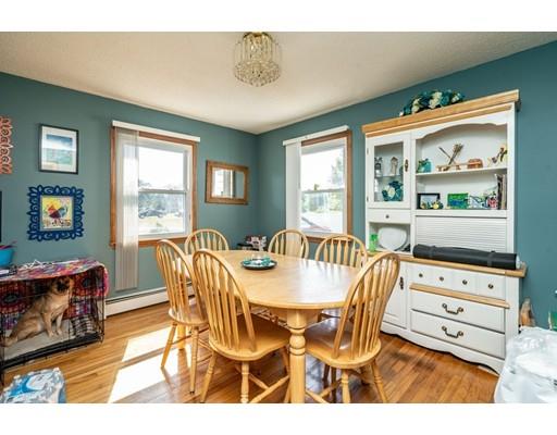 17 Babb Road Southwick, MA 01077 - Photo 6 of 20 a dining room with furniture a flat screen tv and a floor to ceiling window