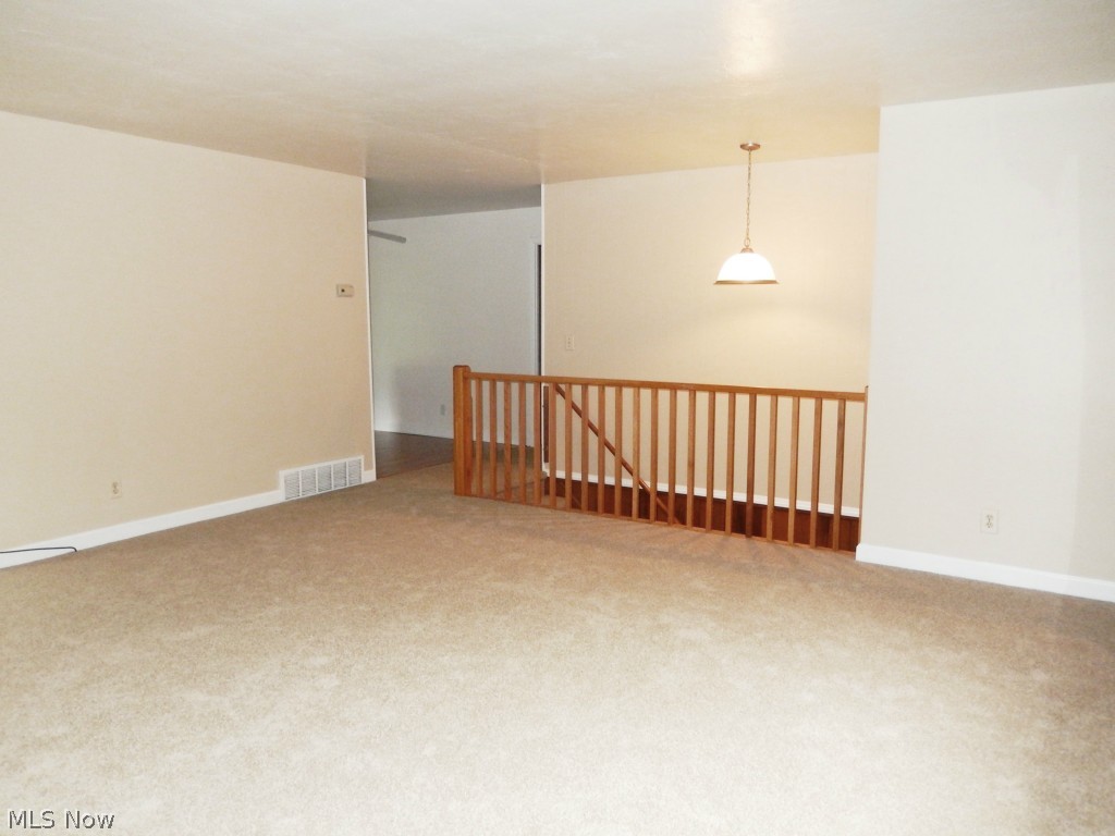 8700 Stone Road Independence, OH 44131 - Photo 3 of 18 Living Room with Neutral Carpet