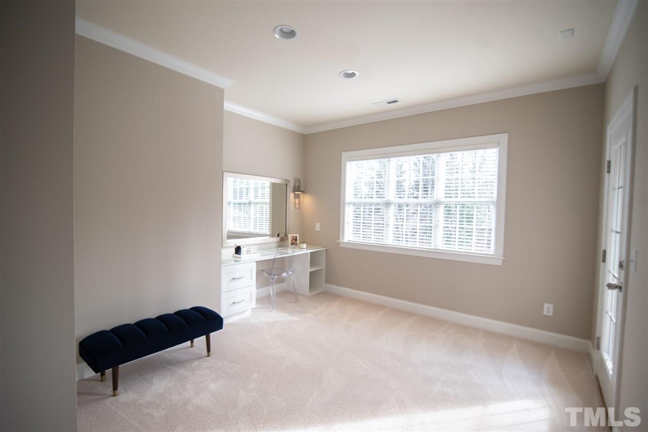 9311 Tabriz Point Raleigh, NC 27614 - Photo 14 of 25 The master bedroom sitting area is so versatile. Use it as a study, vanity or reading nook.