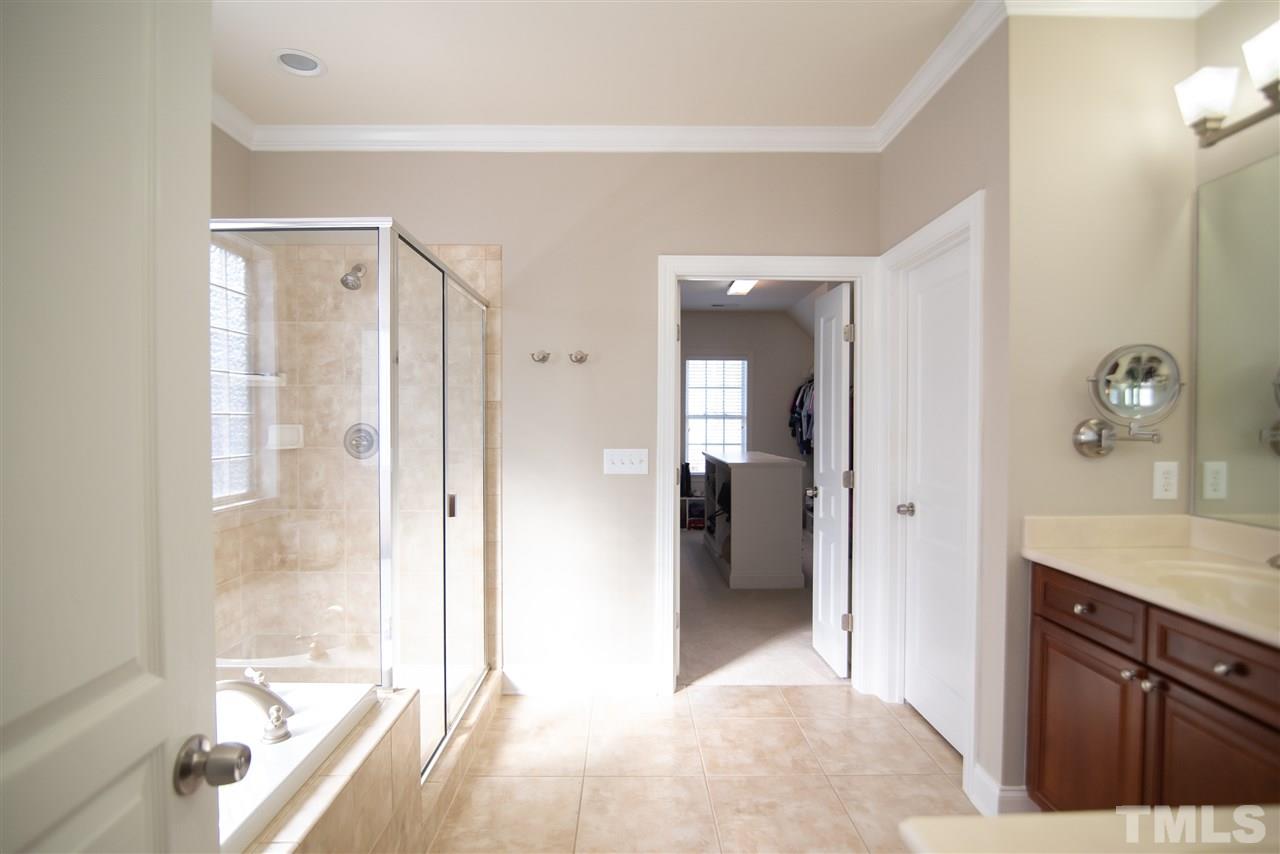 9311 Tabriz Point Raleigh, NC 27614 - Photo 15 of 25 This spa-like master bathroom is the perfect place from some well deserved R&R. His & Hers vanity sinks, soaking tub and step in shower to pamper you!