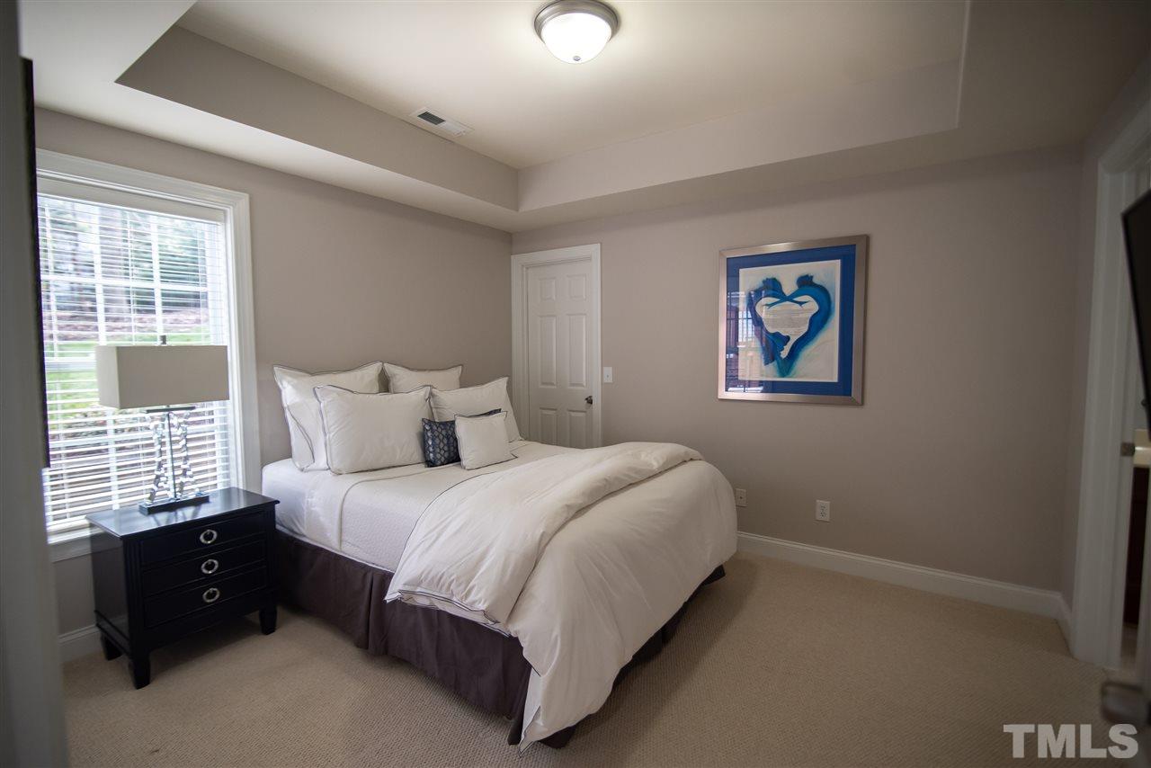 9311 Tabriz Point Raleigh, NC 27614 - Photo 20 of 25 Private basement bedroom provides a peaceful guest retreat.