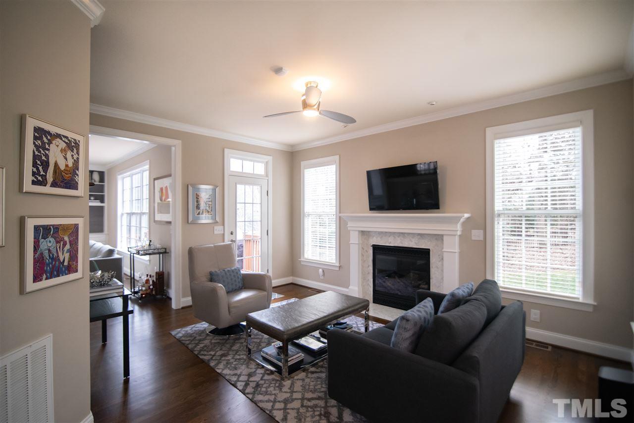 9311 Tabriz Point Raleigh, NC 27614 - Photo 6 of 25 You will love this home all year long from the comfort of this cozy family room with brand new tile surround on fireplace.