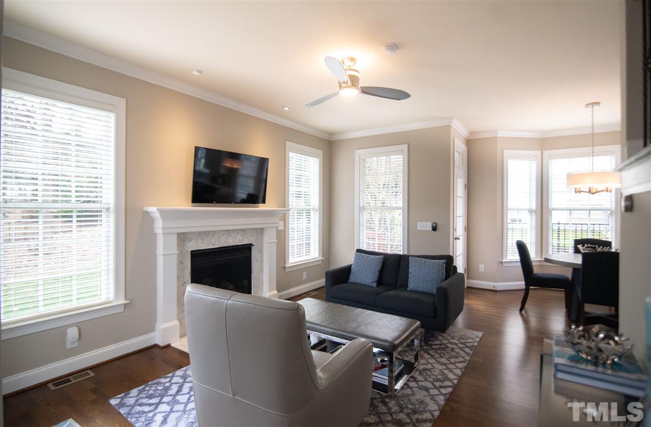 9311 Tabriz Point Raleigh, NC 27614 - Photo 7 of 25 The family room opens nicely to the kitchen, so you never miss a beat when enjoying time with family and friends.