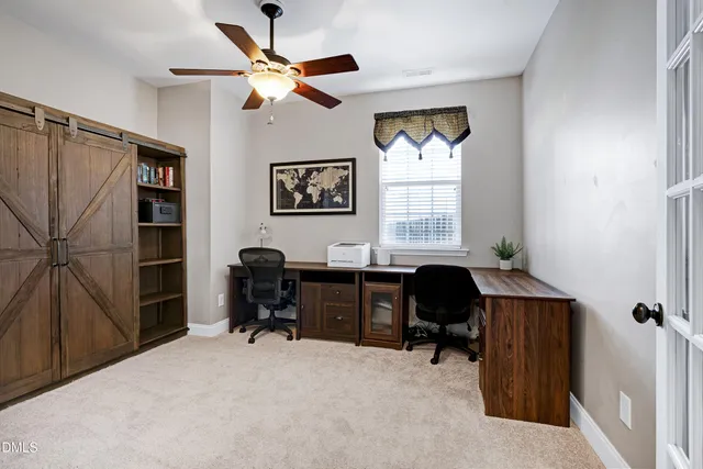 a view of an empty room with shelves