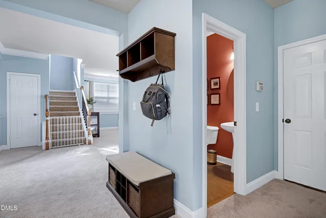 a living room with furniture a large window and a fireplace