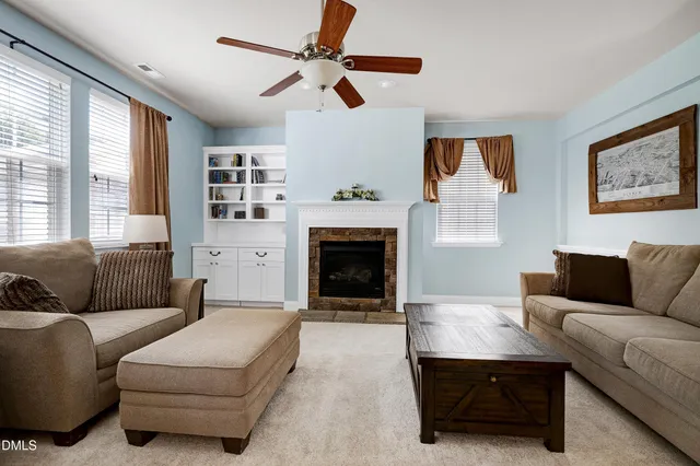 a kitchen with stainless steel appliances granite countertop a stove refrigerator sink and cabinets