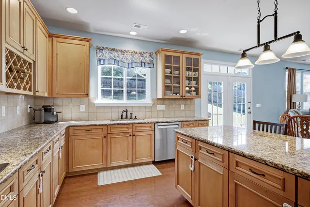 a bathroom with a tub a sink and mirror