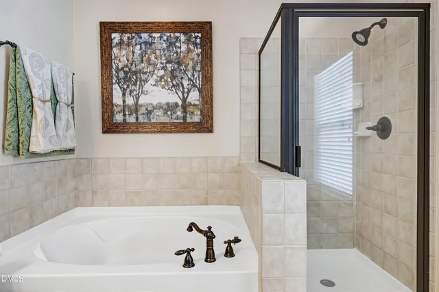 a view of an empty room with closet and windows