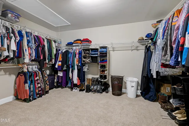 a bedroom with a bed and a television