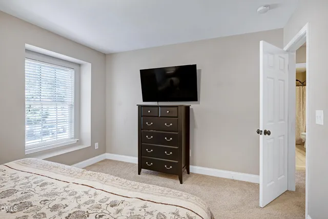 a livingroom with workspace and a couch
