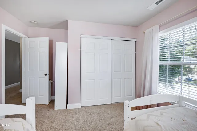 a view of a house with backyard porch and sitting area