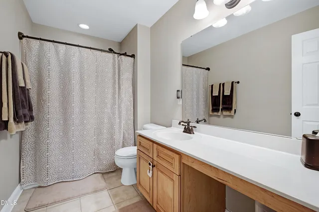 a view of a house with a yard patio and furniture