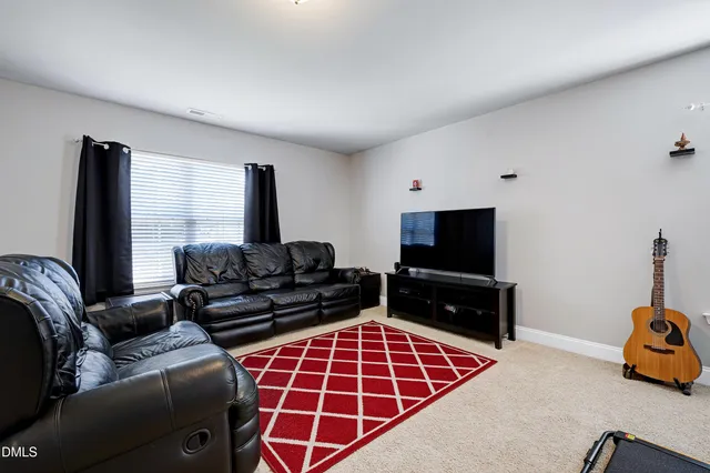 a view of backyard with a chair and table