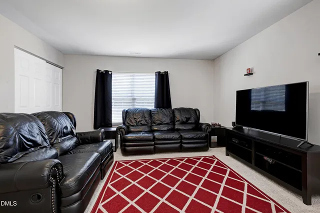 a view of an house with backyard porch and sitting area
