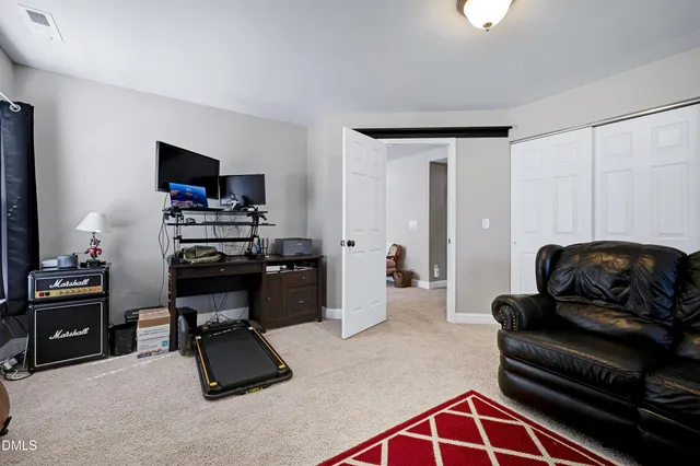 a view of a house with backyard and porch
