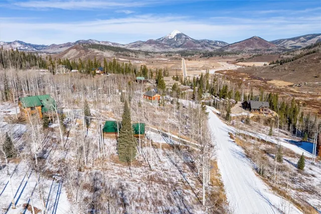 a view of a city with mountains in the background