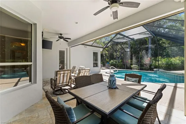 a view of a chair and table on the patio