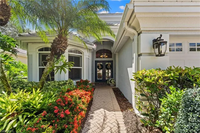 a kitchen with stainless steel appliances granite countertop a stove and cabinets