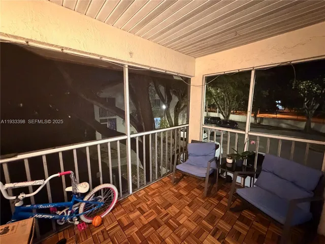 a view of balcony with furniture