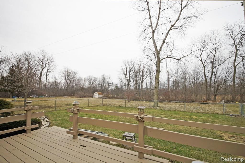 236 North Willard Road Canton, MI 48187 - Photo 19 of 20 LARGE DECK BACKS TO WOODS AND WALKING TRAIL