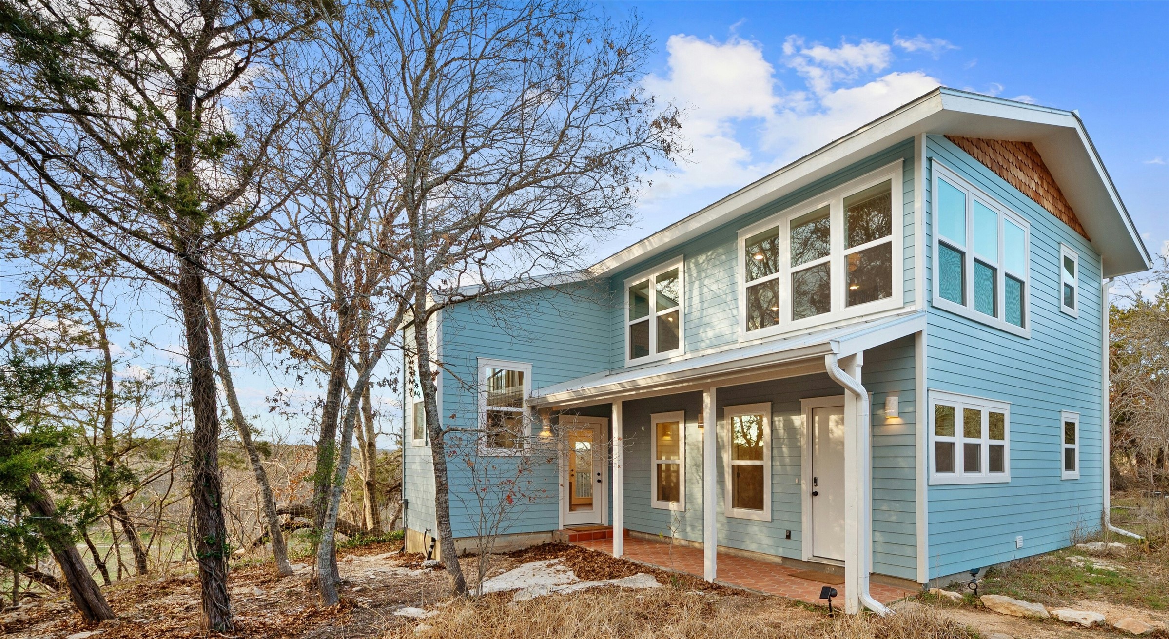 550 Cliffside Road Wimberley, TX 78676 - Photo 29 of 35 a front view of a house with a yard
