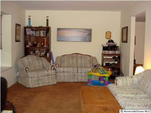 63 Reflection Road Toms River, NJ 08753 - Photo 3 of 3 a bedroom with furniture and a couch