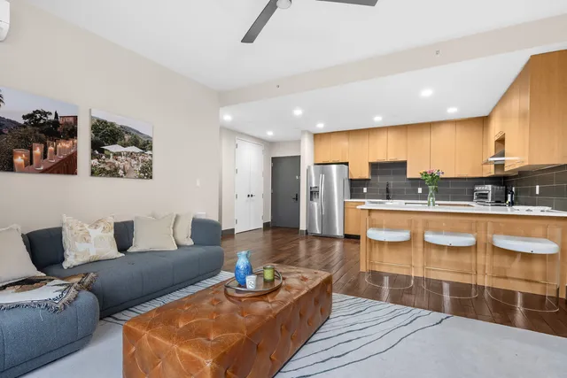 a living room with furniture and a rug