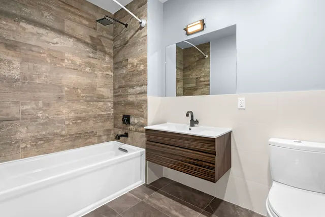 a bathroom with a bathtub and a sink