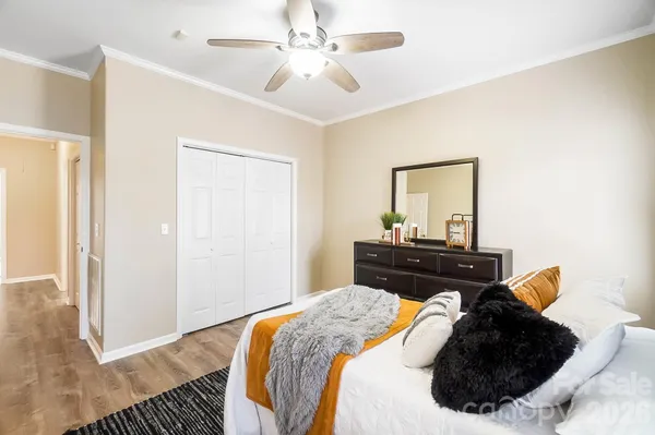 a bed room with a bed and a mirror