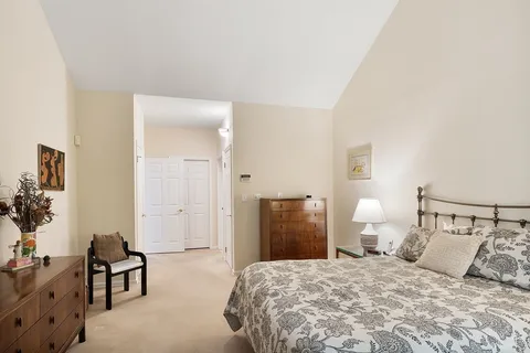 a bedroom with a bed and furniture