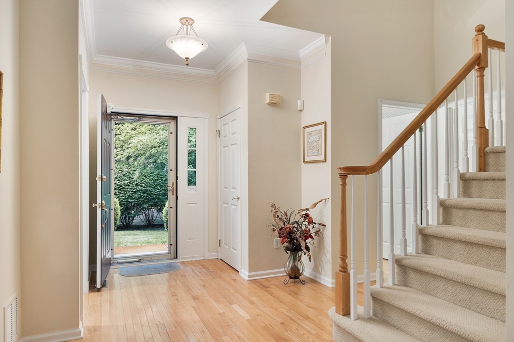 5 Chestnut Lane, Unit 5 Bedford, MA 01730 - Photo 17 of 34 a view of an entryway with wooden floor
