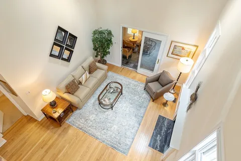 a view of living room with furniture and flat screen tv