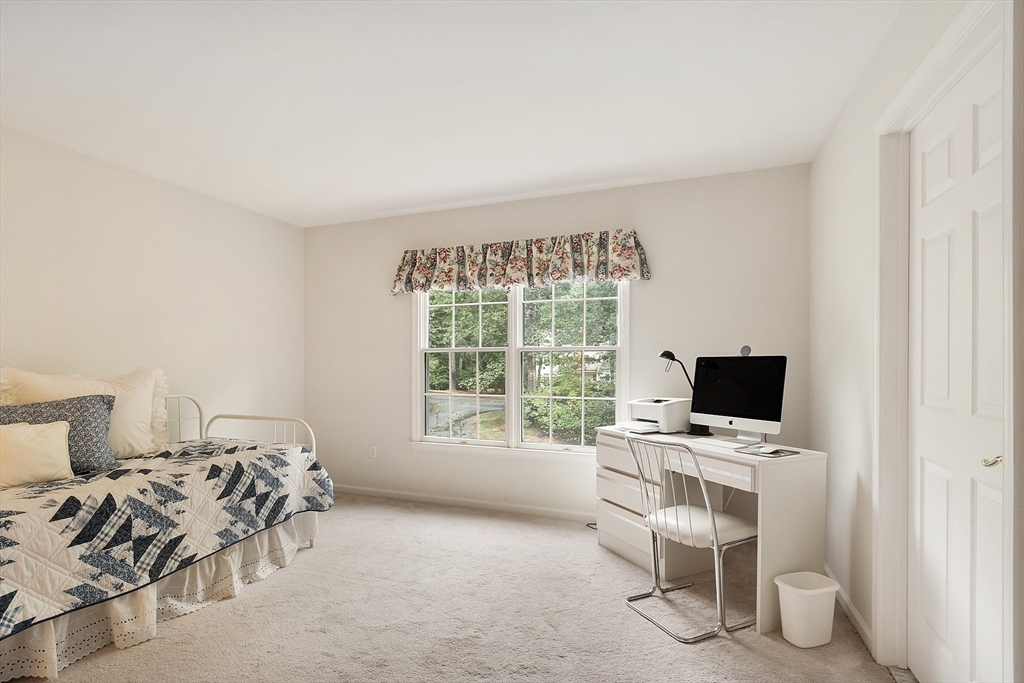 5 Chestnut Lane, Unit 5 Bedford, MA 01730 - Photo 22 of 34 a view of a workspace with furniture and a window