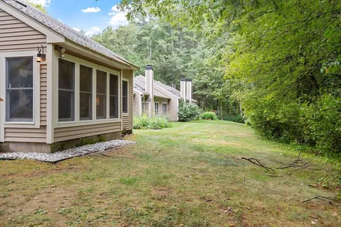 a house with trees in the background