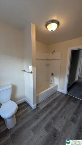a view of a bathroom with a sink and mirror