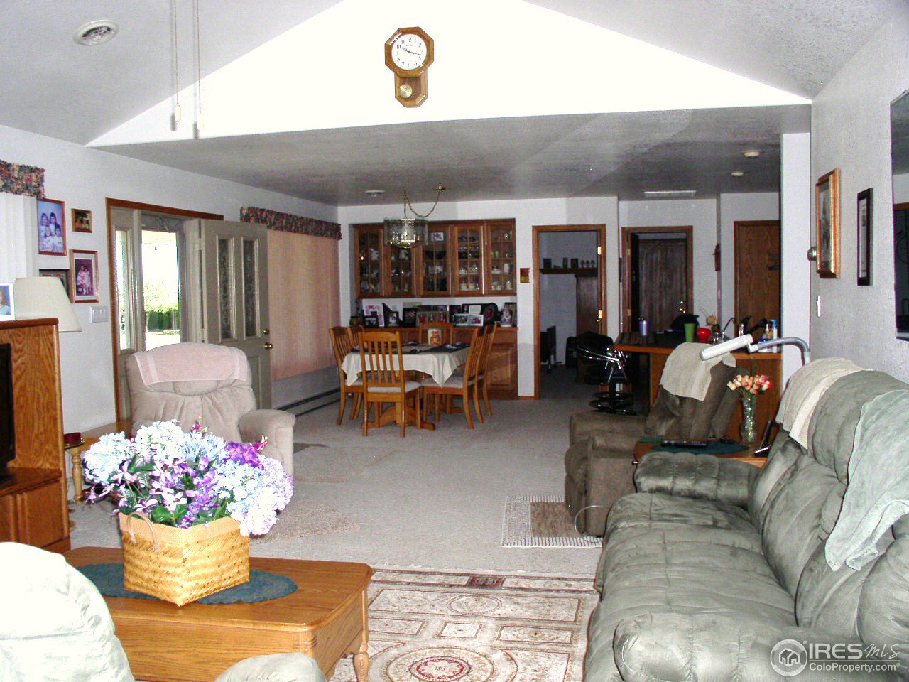 1712 Robin Road Sterling, CO 80751 - Photo 7 of 25 Living Room to Dining Room
