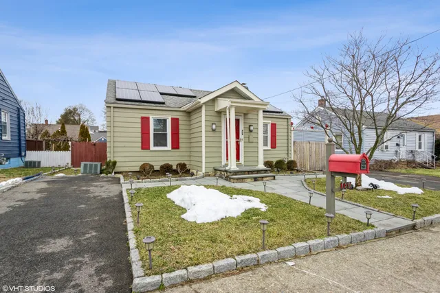 a front view of a house with yard